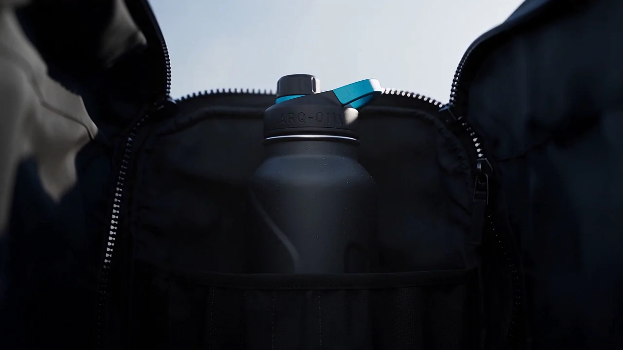 ARQ-01 bottle resting on a wet alpine rock